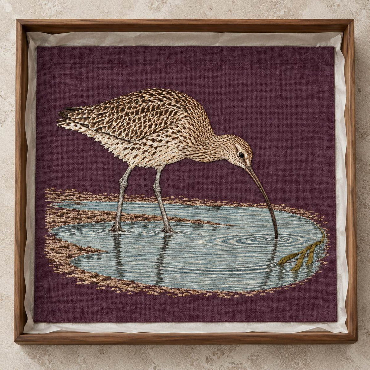 Curlew Under the Long Tide Moon visual mockup shown as a textile panel in a collection tray, with the design on deep plum linen.