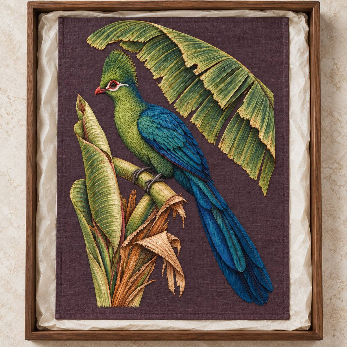 Turaco Beneath the Banana Rib Fan visual mockup shown as a textile panel in a collection tray, with the design on deep plum linen.