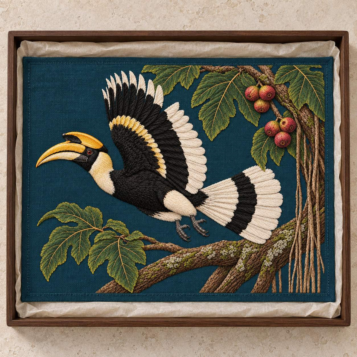Hornbill Above the Fig Vault visual mockup shown as a textile panel in a collection tray, with the design on deep teal-blue linen.