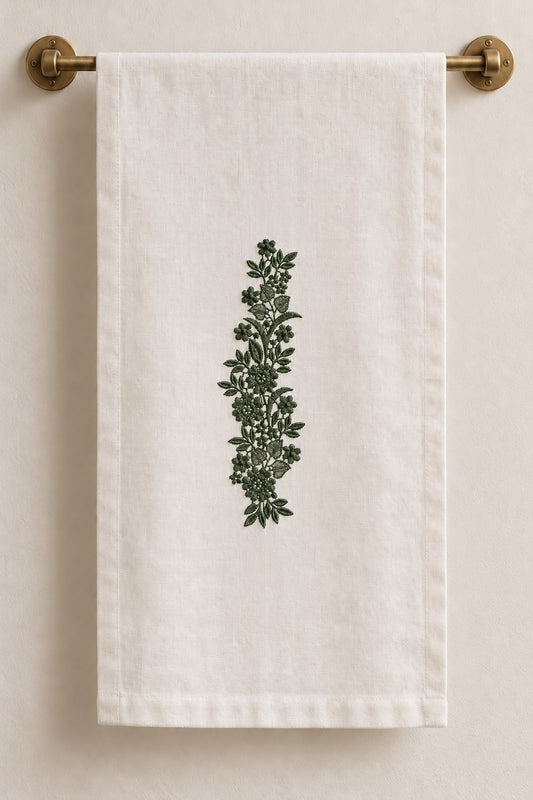 Ivory linen hand towel with one forest green vertical wildflower vine centered on the cloth.