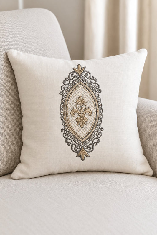 Photorealistic oval fleur filigree frame machine embroidery in graphite and champagne thread on a oversized linen cushion, shown as one fabric-stitched motif