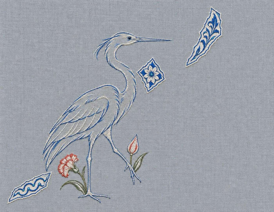 Embroidered heron and separated ornament fragments held apart by a broad grey field
