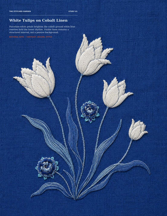 White Ottoman tulips embroidered on deep cobalt linen, showing blue as an active textile ground