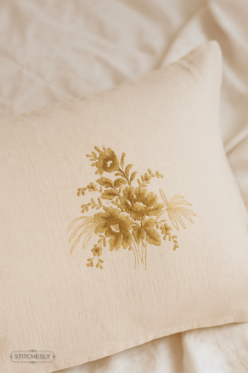 Detail view of Golden Botanical Cushion machine embroidery design