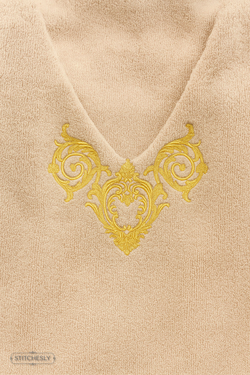 Detail view of Gold Ornamental Cushion machine embroidery design