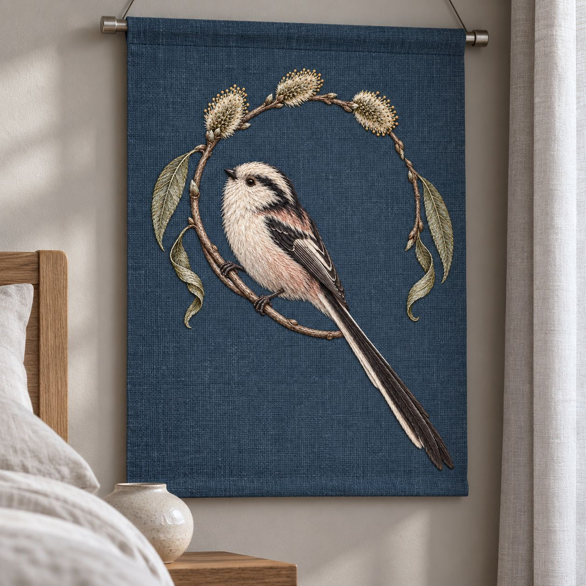 Long Tailed Tit in the Willow Loop visual mockup shown as a hanging textile held by wooden rails, with the design on dark slate-blue linen.