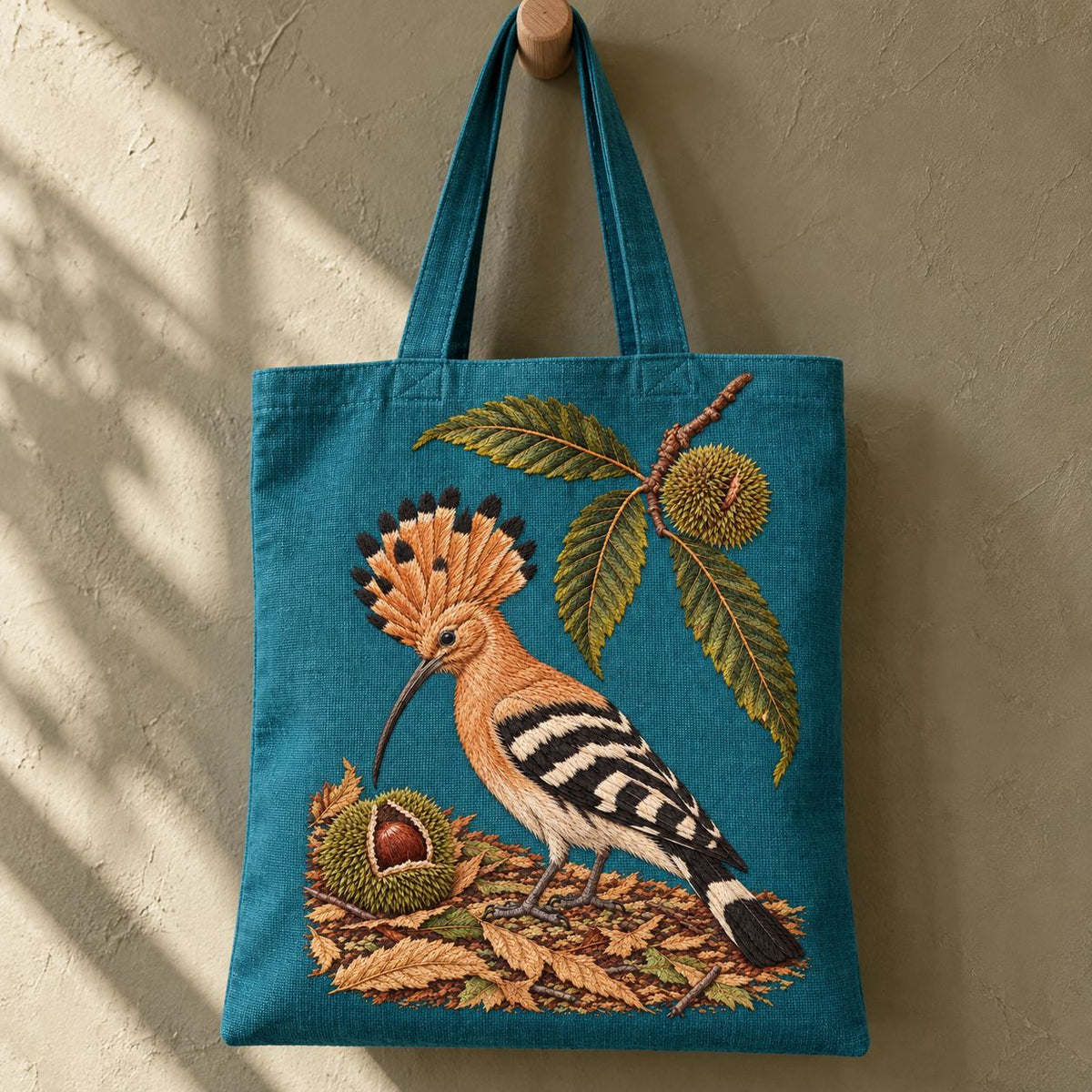 Hoopoe Under the Raised Chestnut Fan visual mockup shown on the front of a structured linen tote, with the design on muted teal linen.