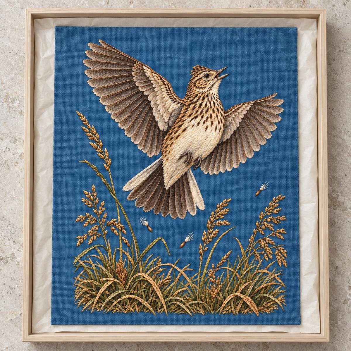 Skylark Above the Broken Seed Horizon visual mockup shown as a textile panel in a collection tray, with the design on muted blue linen.