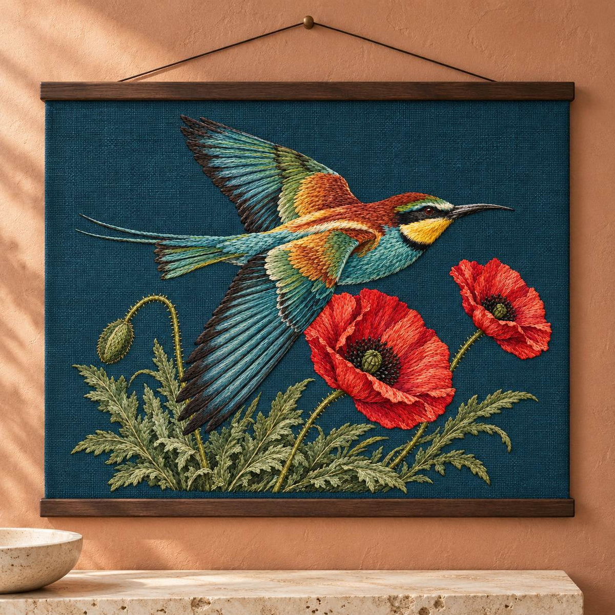 Bee Eater Crossing the Poppy Wind visual mockup shown as a hanging textile held by wooden rails, with the design on dark teal linen.