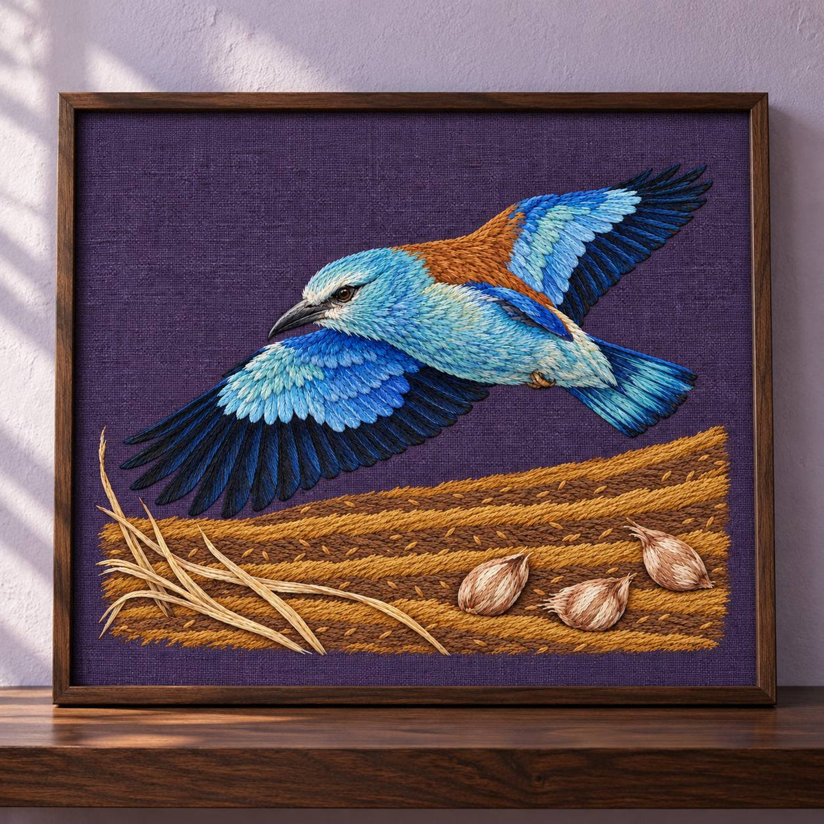 Roller Above the Saffron Field Break visual mockup shown in a frame leaning on a mantel, with the design on plum linen.