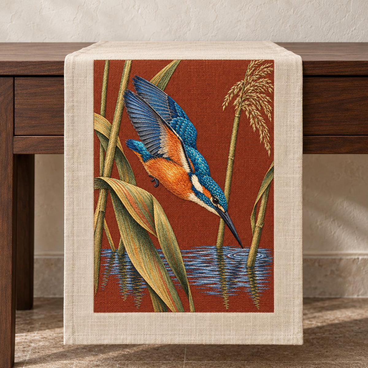 Kingfisher Through the Reed Window visual mockup shown on a textile runner over a console, with the design on terracotta linen.