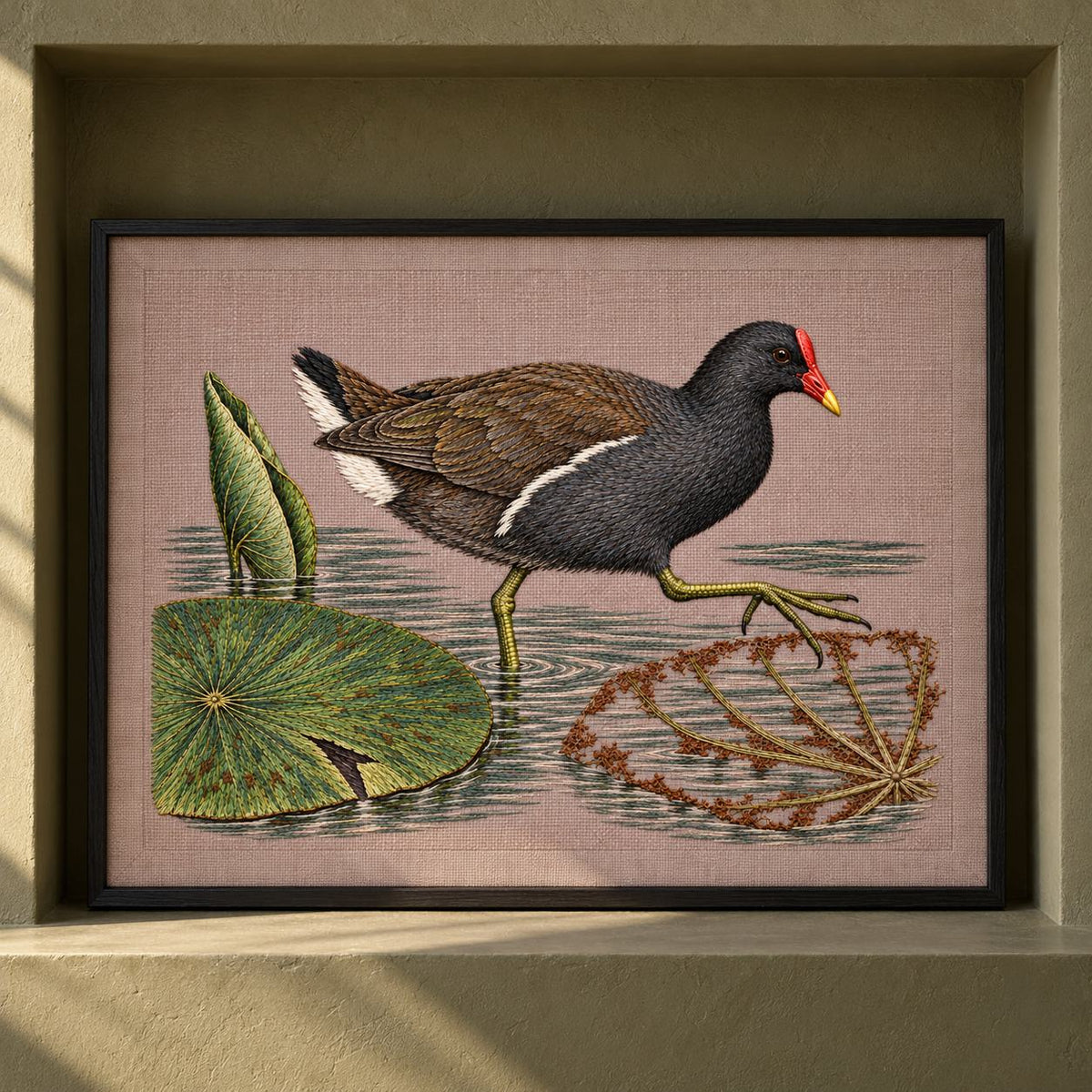 Moorhen Along the Lily Rib Passage visual mockup shown as a framed textile in a gallery niche, with the design on warm mushroom linen.
