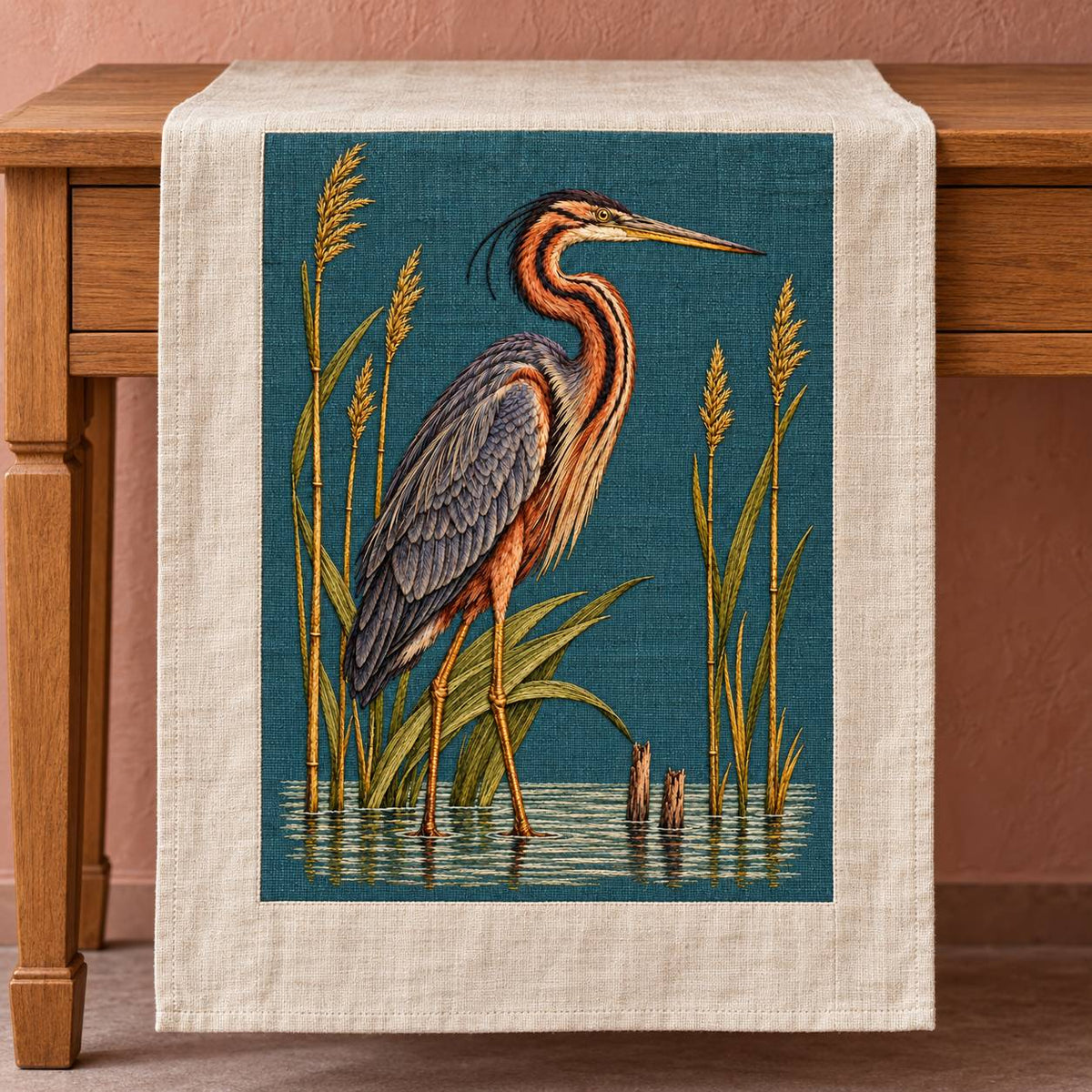 Purple Heron Inside the Reed Cathedral visual mockup shown on a textile runner over a console, with the design on deep teal linen.