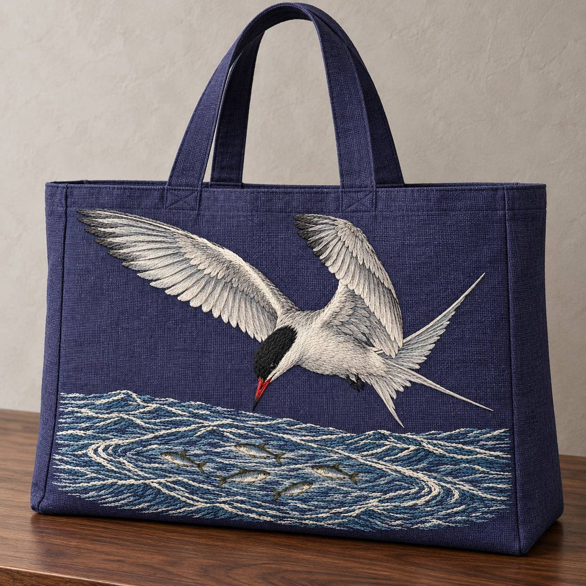 Common Tern Above the Silver Shoal visual mockup shown on the front of a structured linen tote, with the design on deep blue-violet linen.