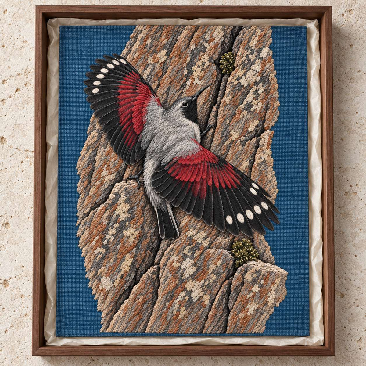 Wallcreeper on the Vermilion Cliff visual mockup shown as a textile panel in a collection tray, with the design on slate-blue linen.
