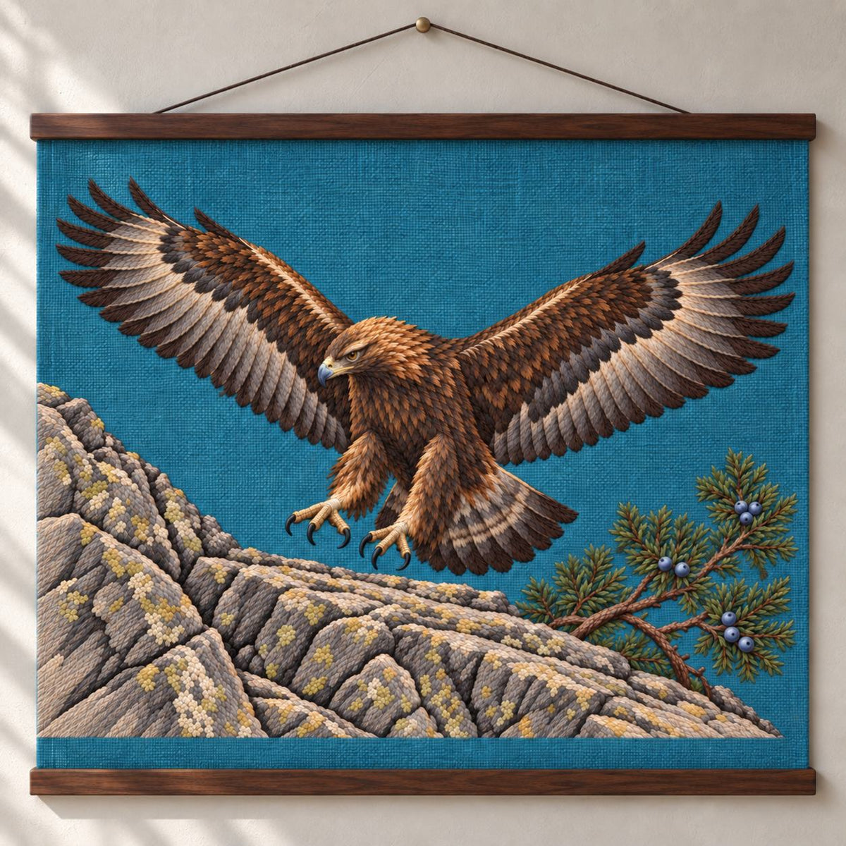 Golden Eagle Above the Juniper Shelf visual mockup shown as a hanging textile held by wooden rails, with the design on teal-blue linen.