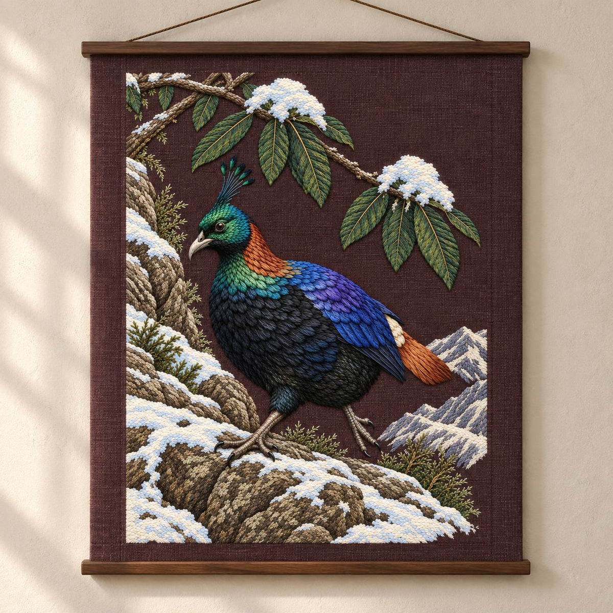 Monal Under the Rhododendron Snow visual mockup shown as a hanging textile held by wooden rails, with the design on deep plum-brown linen.