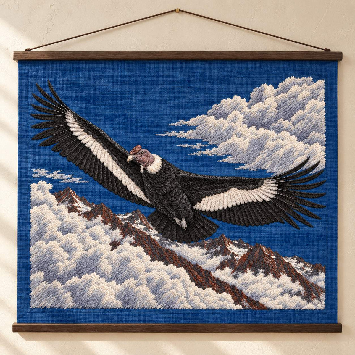 Condor Beyond the High Cloud Gate visual mockup shown as a hanging textile held by wooden rails, with the design on deep blue linen.