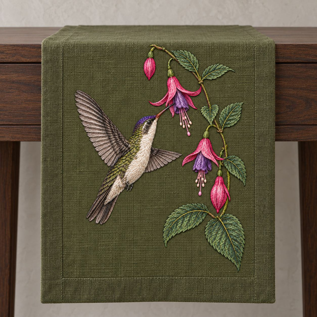 Violet Crown at the Fuchsia Cascade visual mockup shown on a textile runner over a console, with the design on dark olive linen.