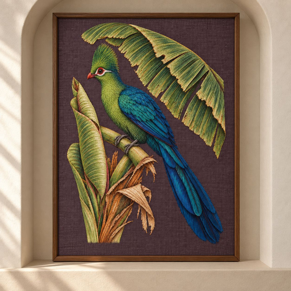 Turaco Beneath the Banana Rib Fan visual mockup shown as a framed textile in a gallery niche, with the design on deep plum linen.