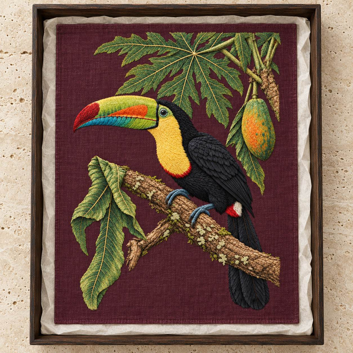 Toucan Under the Papaya Canopy visual mockup shown as a textile panel in a collection tray, with the design on deep burgundy linen.