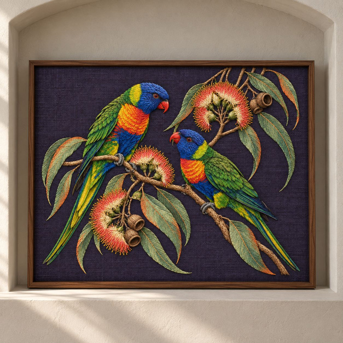 Lorikeet Across the Eucalyptus Fire visual mockup shown as a framed textile in a gallery niche, with the design on deep violet linen.