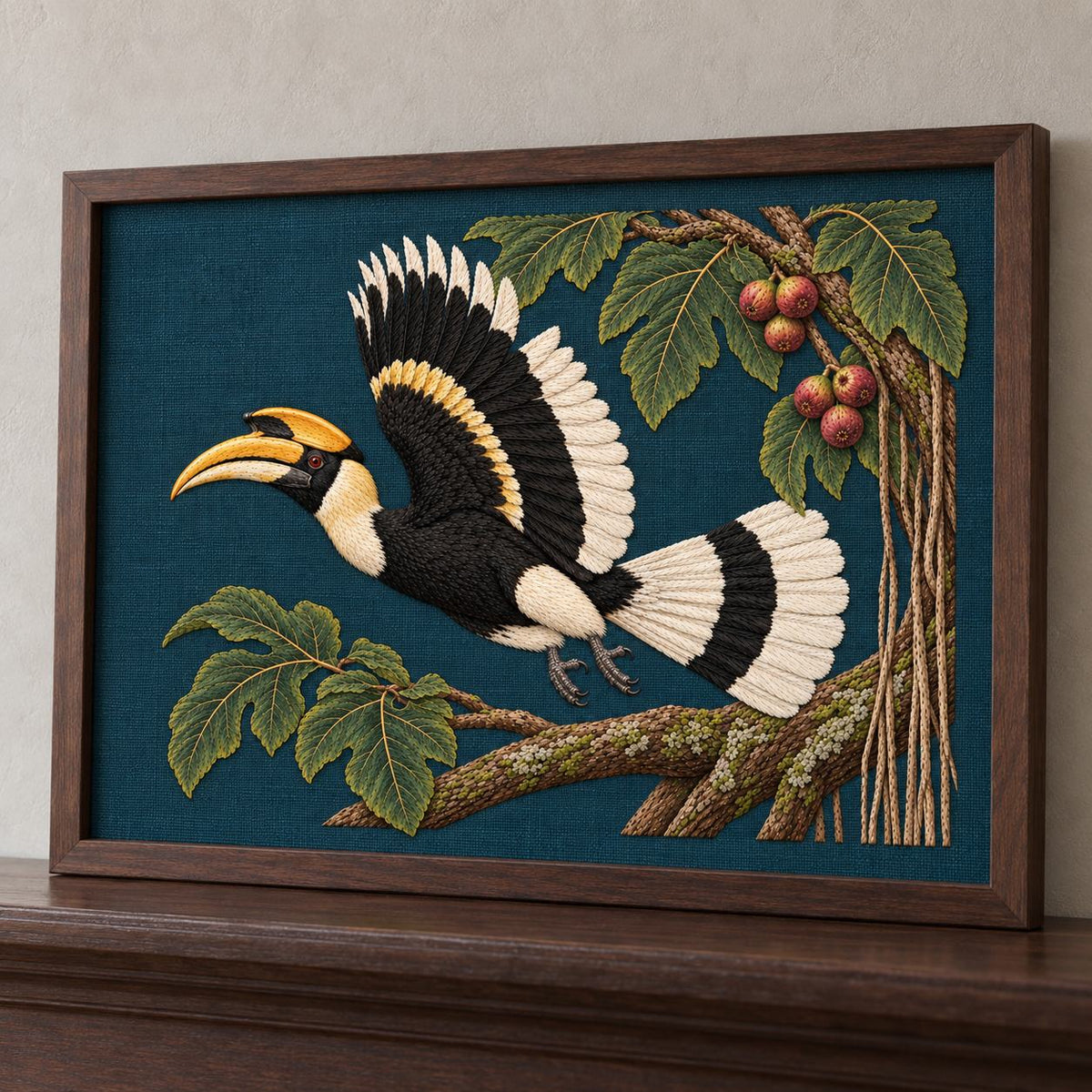 Hornbill Above the Fig Vault visual mockup shown in a frame leaning on a mantel, with the design on deep teal-blue linen.