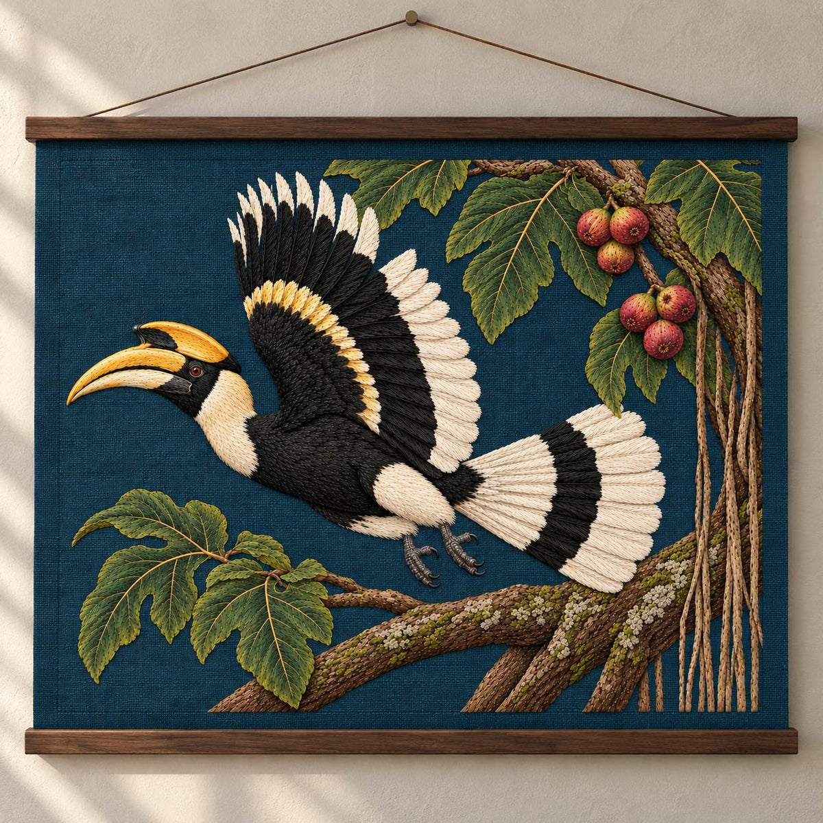 Hornbill Above the Fig Vault visual mockup shown as a hanging textile held by wooden rails, with the design on deep teal-blue linen.