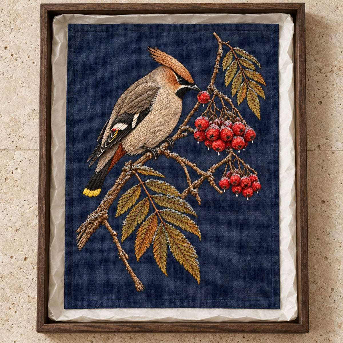 Waxwing at the Frozen Rowan Cluster visual mockup shown as a textile panel in a collection tray, with the design on deep navy linen.