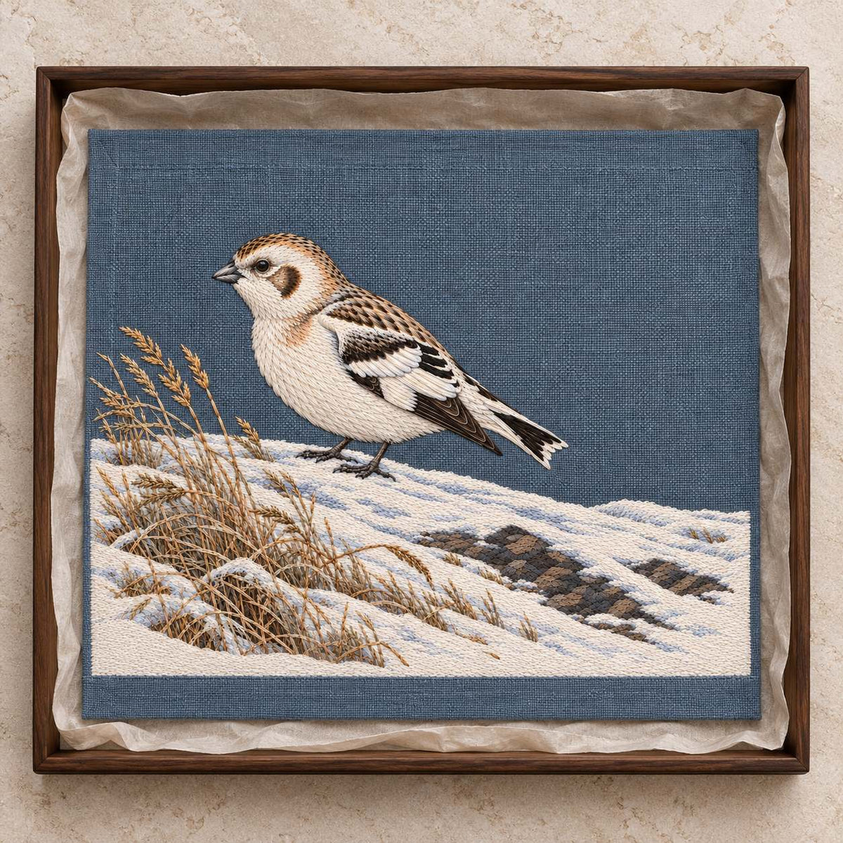 Snow Bunting at the Wind Scoured Drift visual mockup shown as a textile panel in a collection tray, with the design on blue-grey linen.