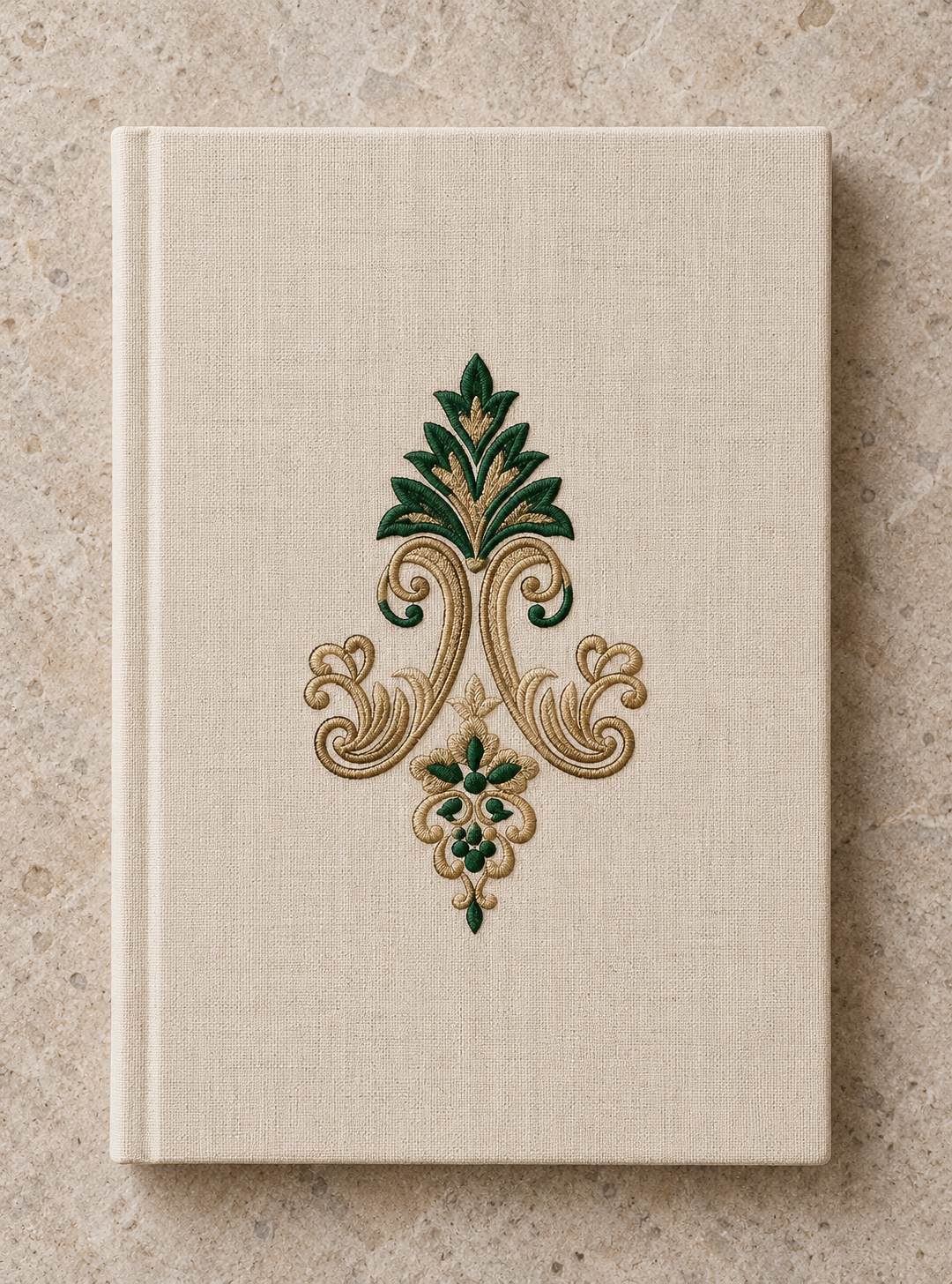 Acanthus Crown Floral Drop embroidered in parchment and forest green on a linen notebook cover, showing the complete two-color motif.