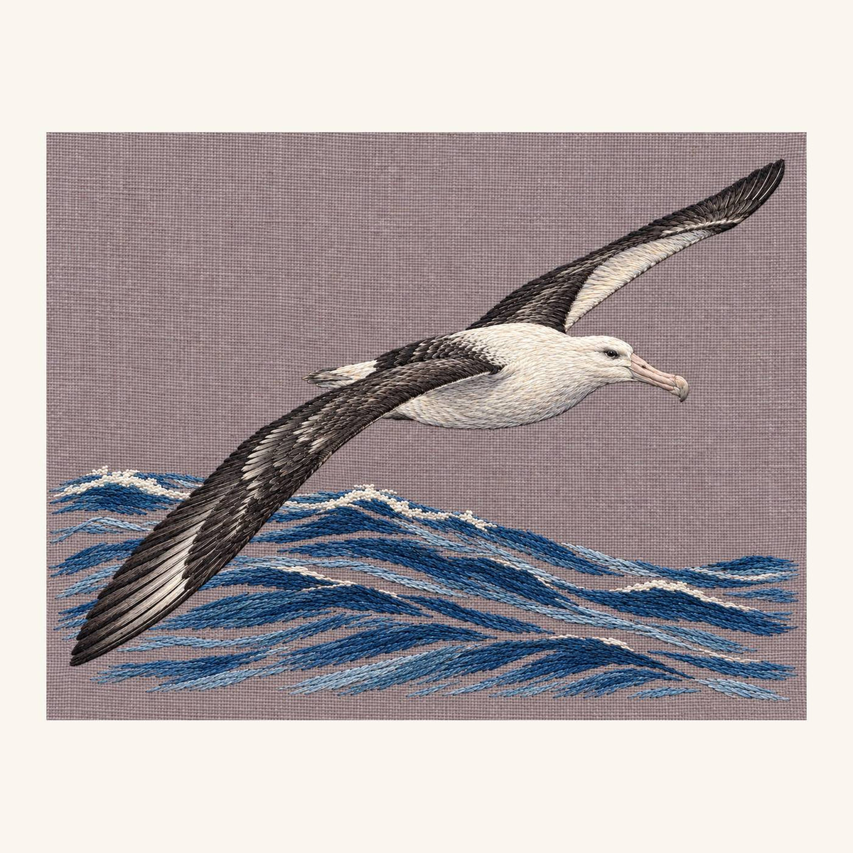 Digital embroidery reference showing an albatross above an open ocean swell on soft taupe-grey linen, landscape composition.