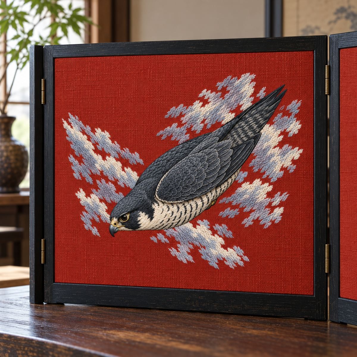 Peregrine Falcon embroidery design in a digital mockup of horizontal embroidery on broad black wood folding screen linen insert. Placement inspiration for Study 04.
