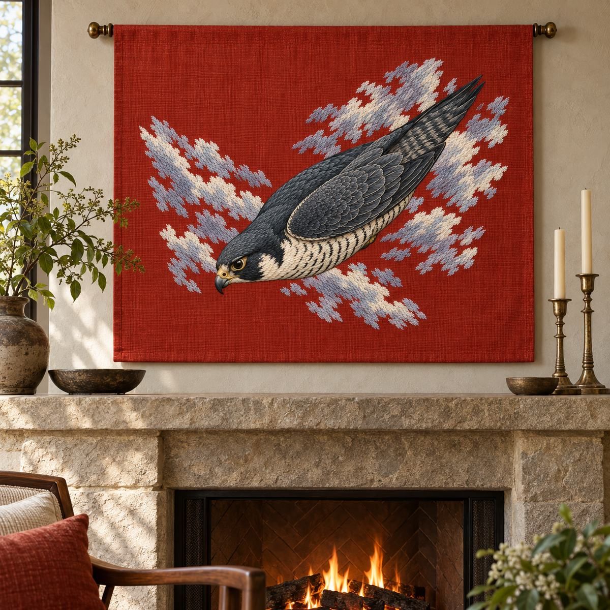 Peregrine Falcon embroidery design in a digital mockup of wide vermilion linen mantel panel hanging flat above a stone fireplace. Placement inspiration for Study 04.