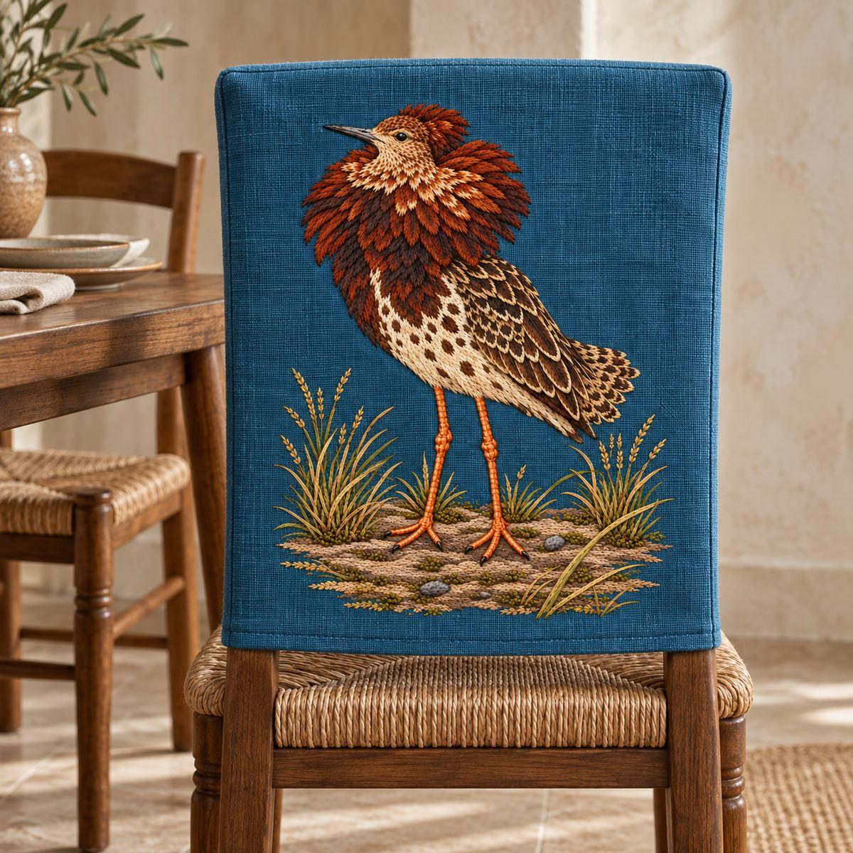 Ruff embroidery design in a digital mockup of A portrait embroidered front panel on a fitted chair-back slipcover for an armless wooden dining chair; no motif folded over the top edge, plaster dining room with simple rush seats. Placement inspiration for Study 16.