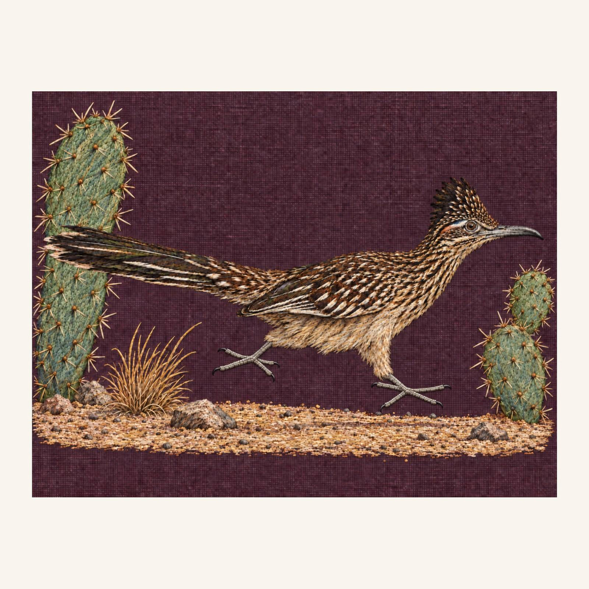 Digital embroidery reference showing a roadrunner between desert cacti on deep muted aubergine-brown linen, landscape composition.