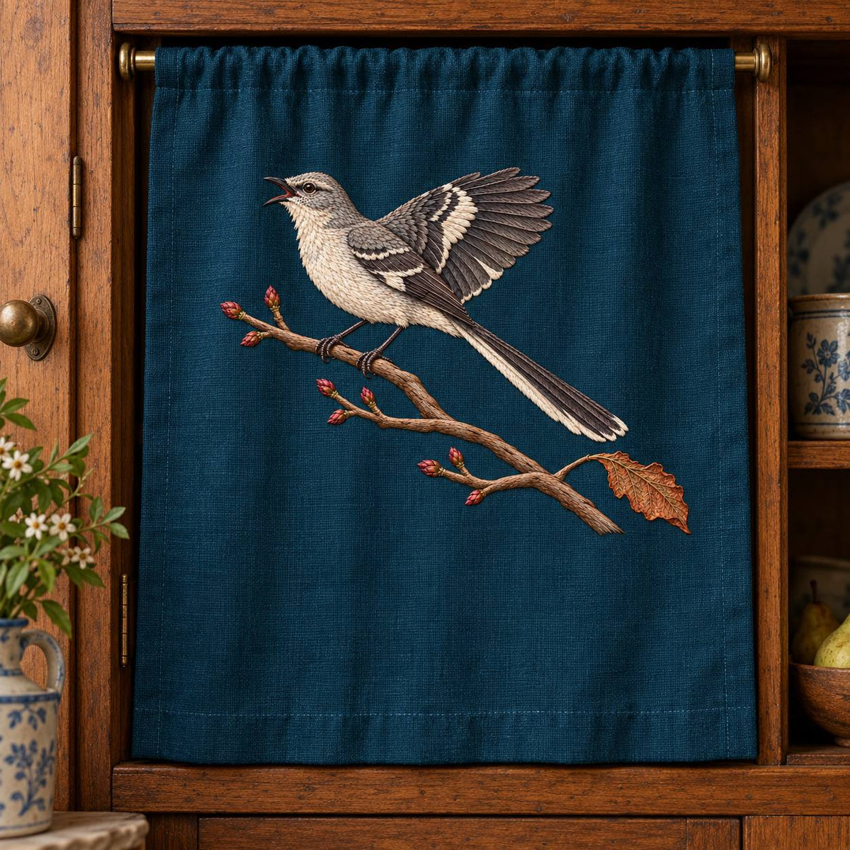 Mockingbird embroidery design in a digital mockup of Cabinet Curtain. Placement inspiration for Study 52.
