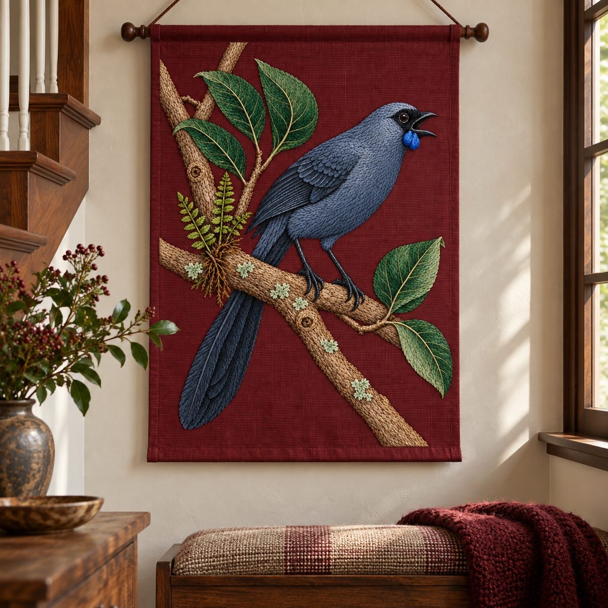 Kokako embroidery design in a digital mockup of vertical burgundy textile banner suspended from a fine walnut rod in a quiet stair alcove. Placement inspiration for Study 54.