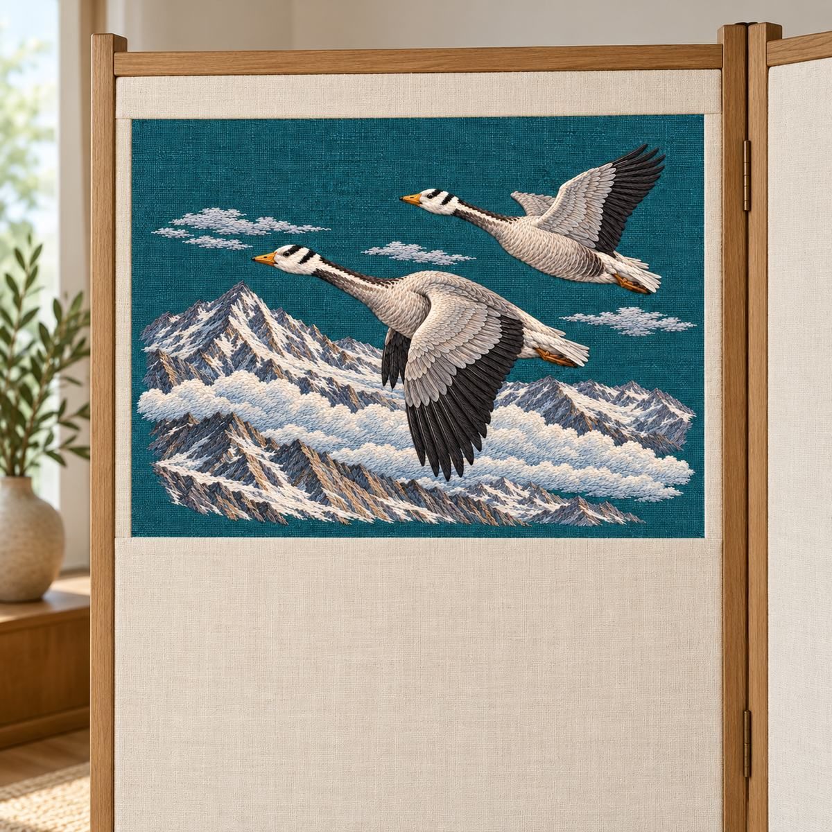 Bar-headed Goose Pair embroidery design in a digital mockup of A tall simple two-panel dressing screen with ONE landscape teal embroidery insert in its upper half, all other fabric blank ivory; focus closely on complete insert. Placement inspiration for Study 64.
