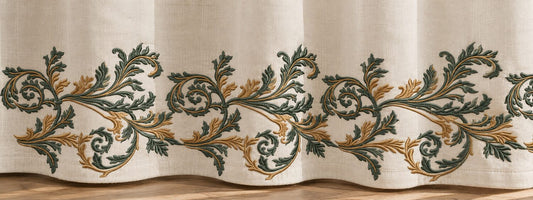 Blue-green and copper acanthus machine embroidery repeated along a linen curtain hem on one baseline