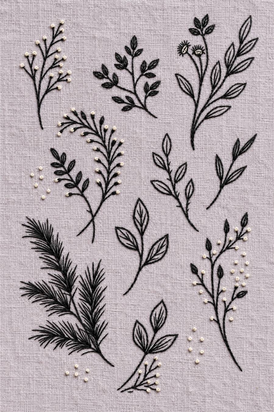 Hand embroidery of an airy botanical sampler of separate seed stems, small leafy twigs, open-leaf branches and a fine needle-leaf sprig at lower left in charcoal and ivory cotton on soft pale dusty lavender linen.
