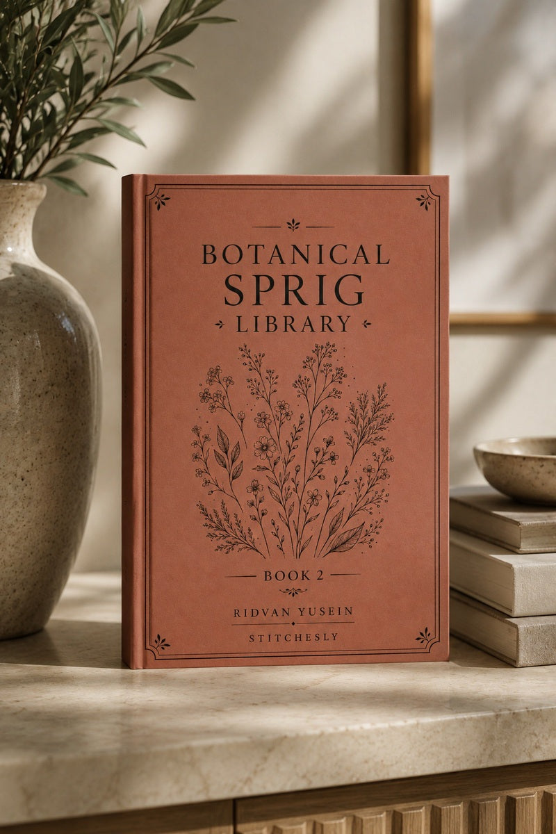 Botanical Sprig Library Book Two standing beside flowers.