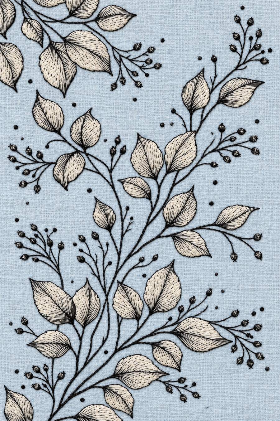 Hand embroidery of a sweeping diagonal composition of large veined pointed leaves with branching buds and original cropped leaves at the top left and bottom edges in charcoal and ivory cotton on soft pale powder blue linen.