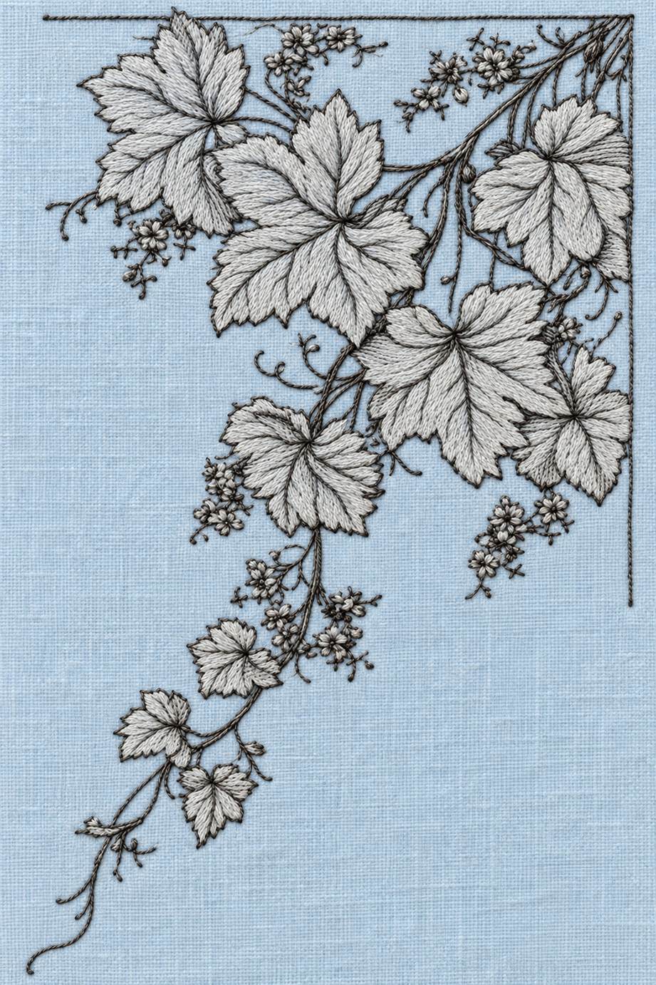Fine cotton embroidery of trailing grapevine corner on powder blue linen.