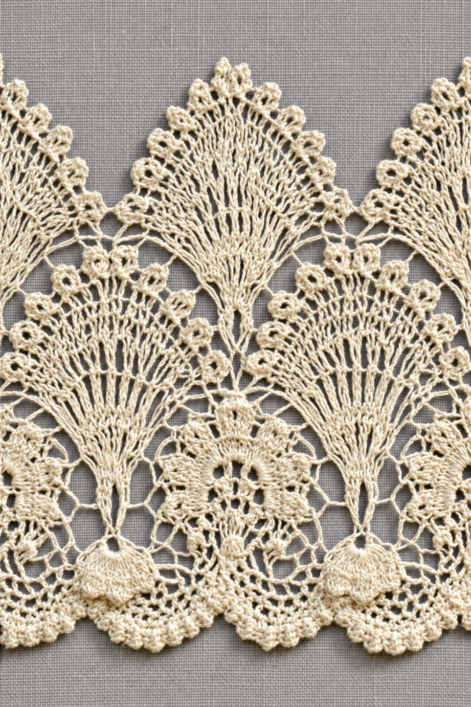 Fine cotton hand-worked lace of tall fan and rosette lace border, from Crochet Lace Borders and Edgings Book Three.