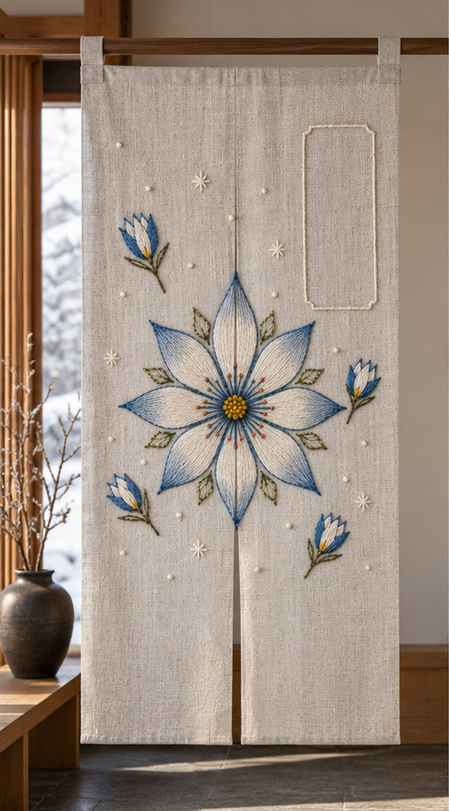 Framed linen panel mockup featuring the Eight-Petal Snowflower hand embroidery design. A large eight-petal snowflower sits with detached buds and sparse frost stars beside an empty label shape.