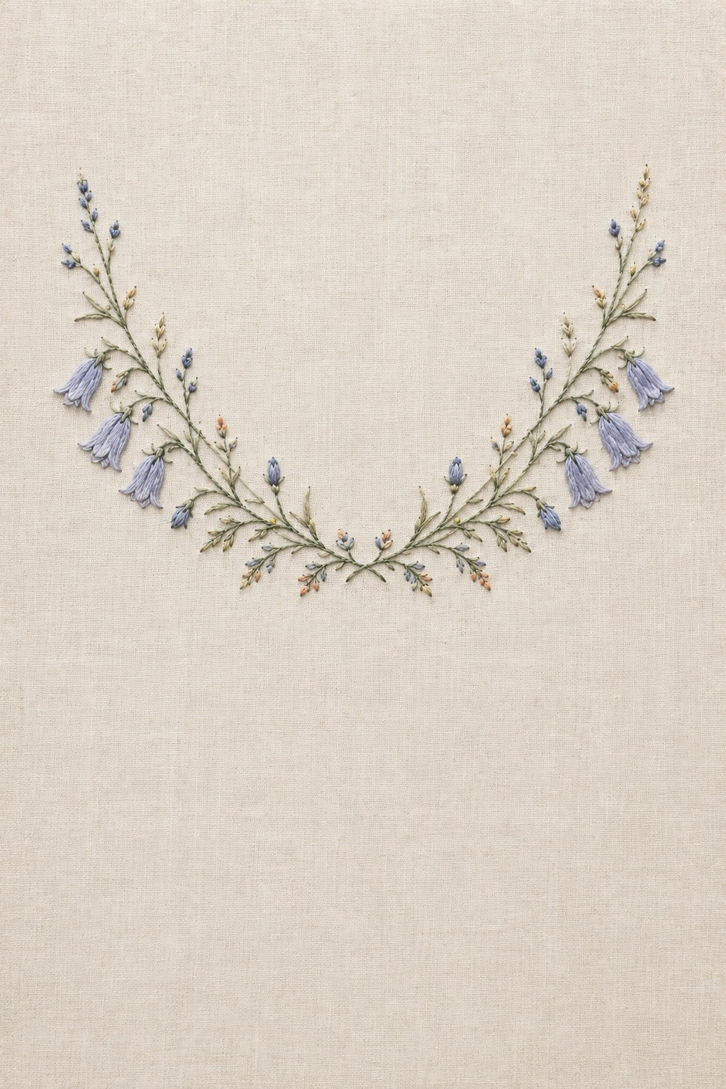 Illustrative embroidery design: Blue harebells, buds and fine foliage follow a shallow collar arc.
