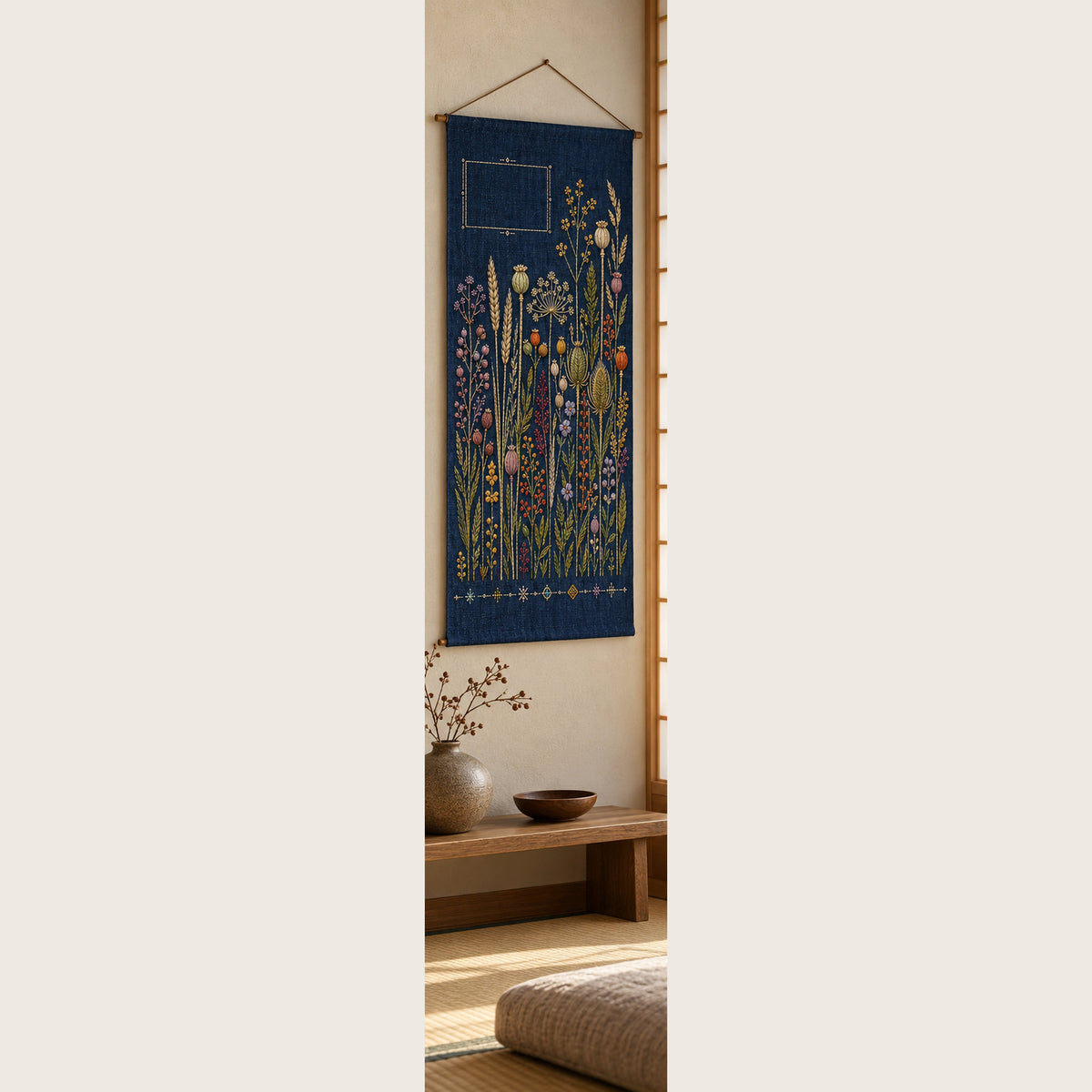 Navy botanical panel mockup featuring the Indigo Seed Garden hand embroidery design. Seed heads rise across indigo linen below a small rectangular opening.