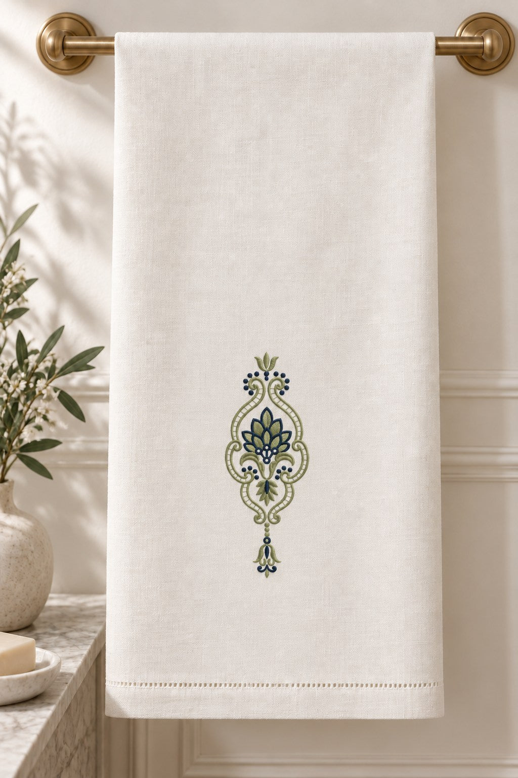 Leaf Fan Scroll Pendant embroidered in smoky sage and ink blue on a linen guest towel, showing the complete two-color motif.