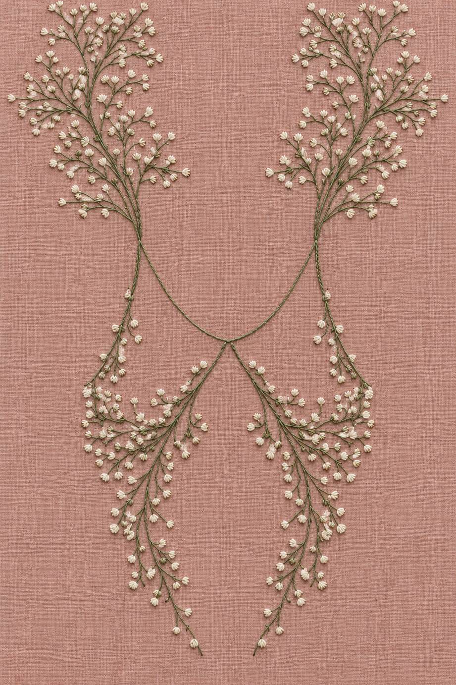 Fine cotton embroidery of four bud sprays around open neckline on dusty rose linen, from Neckline and Collar Embroidery Designs Book One.
